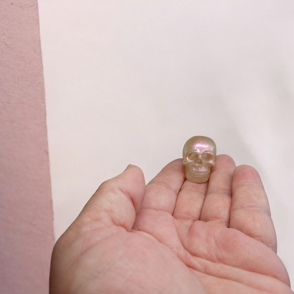 Shimmery peach resin skull